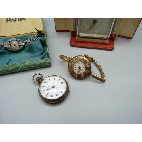 1090 - A cased travel alarm clock, a silver fob watch and two lady's cocktail wristwatches