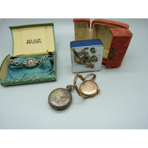 1090 - A cased travel alarm clock, a silver fob watch and two lady's cocktail wristwatches