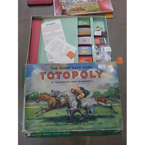 1130 - A Totopoly board game and a Touring England game plus a tin of early 20th Century packaging in a Dun... 