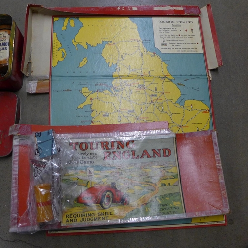 1130 - A Totopoly board game and a Touring England game plus a tin of early 20th Century packaging in a Dun... 