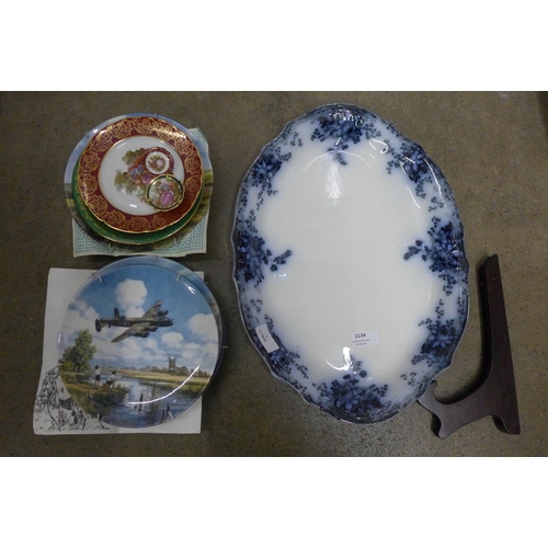 1134 - A large oval flow blue serving plate with stand, three Royal Doulton Heroes of The Sky WWII aircraft... 