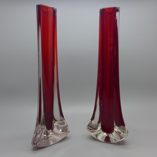 605 - A pair of Whitefriars glass tricon cased ruby red vases, 1957-1965, 24cm