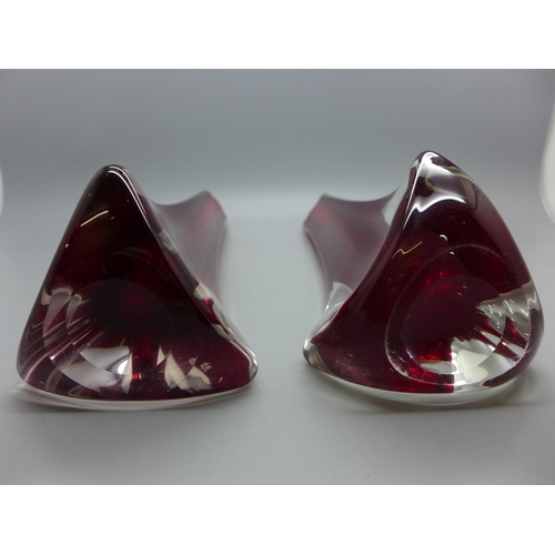 605 - A pair of Whitefriars glass tricon cased ruby red vases, 1957-1965, 24cm