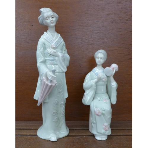611 - Two porcelain figures of Oriental ladies