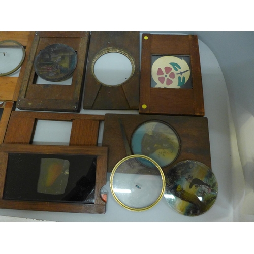 633 - A collection of wooden framed magic lantern slip slides, some incomplete