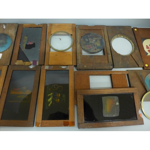 633 - A collection of wooden framed magic lantern slip slides, some incomplete