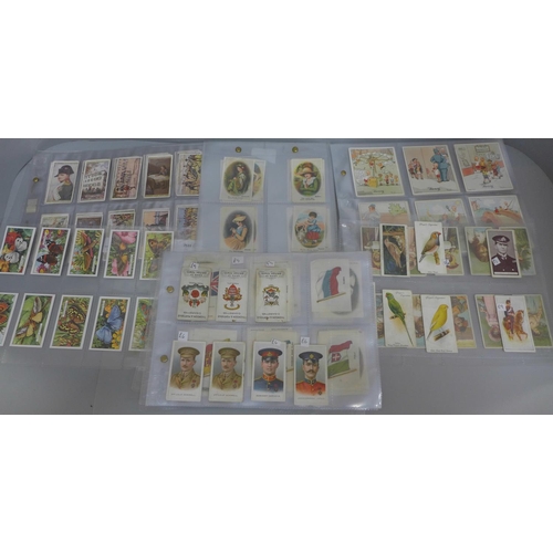 638 - A collection of cigarette cards including early cards and silks