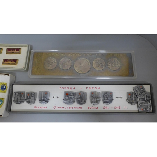 649 - A collection of Soviet era Russian badges; Naval, Aeroflot and 'Hero City' plus a cased set of medal... 