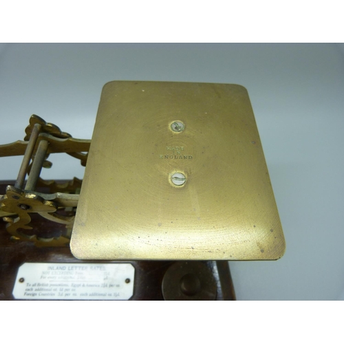 650 - Victorian postal scales, circa 1880 with brass weights and ivorine label listing postal costs