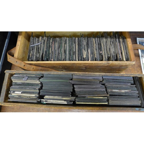 657 - Two wooden boxes of approximately 200 magic lantern slides, for restoration