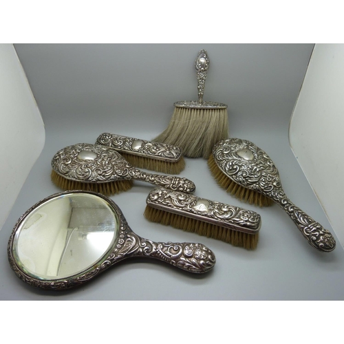 660 - An Edwardian six piece lady's silver backed dressing table set, Chester and Birmingham hallmarks