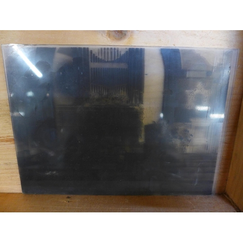663 - A wooden box of approximately forty-five half glass plate negatives
