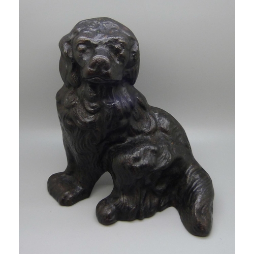 665 - An Edwardian cast iron door stop in the form of a spaniel dog, maker W. Bullock & Co., numbered 68, ... 