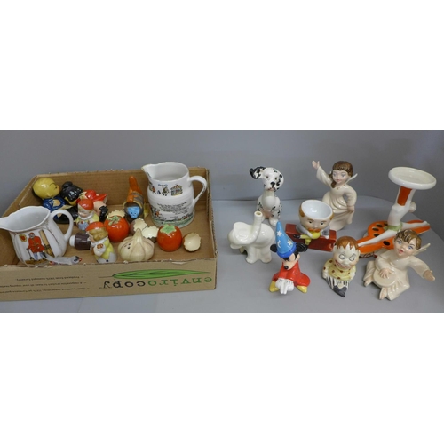687 - A collection of novelty salt and peppers, a nursery rhyme jug, a Fantasia salt and pepper, etc.