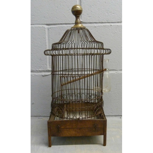 690 - A French wire work bird cage with original glass bottle, circa 1850-1880, 53cm tall, damage to lower... 