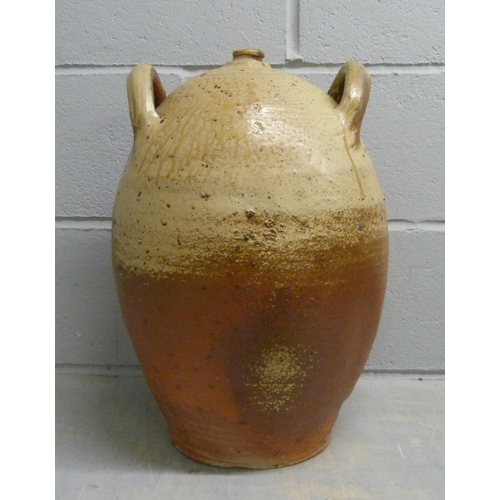 695 - A French 19th century village-made walnut oil jar, 47cm