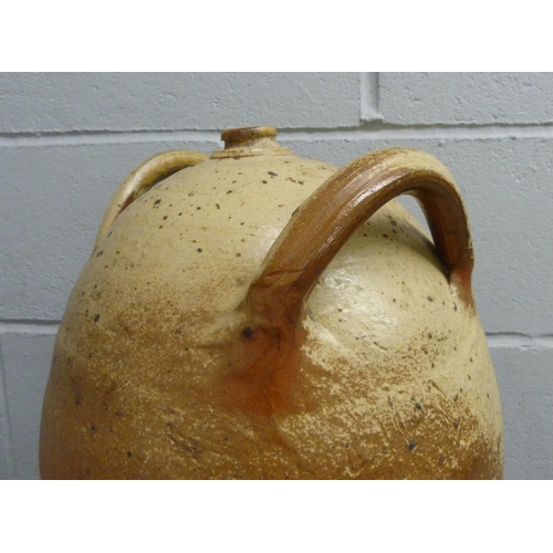 695 - A French 19th century village-made walnut oil jar, 47cm