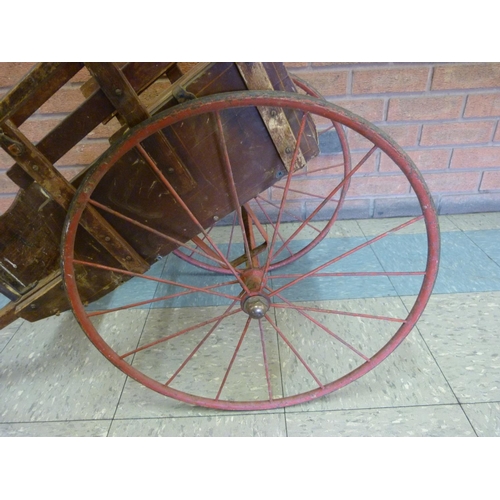 700 - An estate-built late 19th Century dog cart with simple inlay, safety chain and red painted wheels, f... 