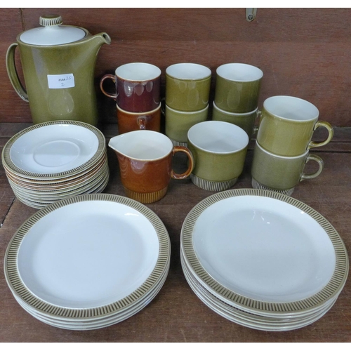 702 - A Poole coffee set - two colourways