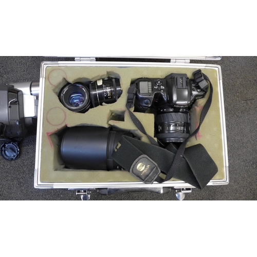 721 - A Minolta Dynax 500si camera, with lenses, cased, an Agfa camera and a JVC video camera