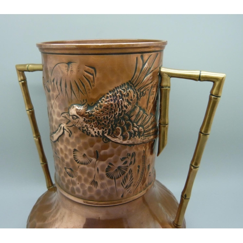 730 - A late 19th Century Arts and Crafts copper and brass twin-handled vase in the manner of Christopher ... 