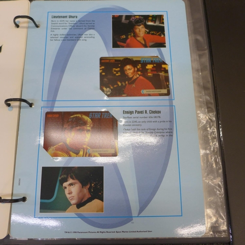 753 - Three folders of Star Trek phone cards
