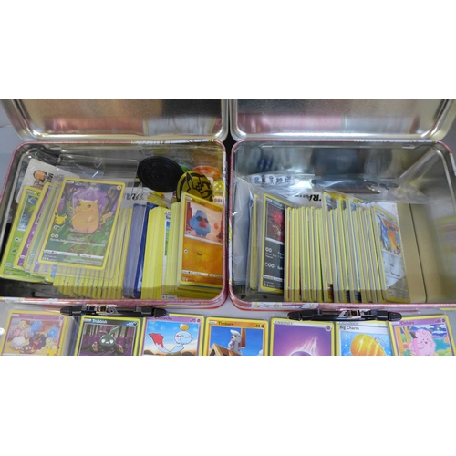757 - 600 Pokemon cards including holographic, celebrations, coins, dice, etc.