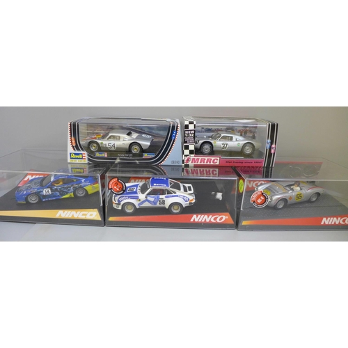 765 - Five Porsche slot car racing cars including three Ninco