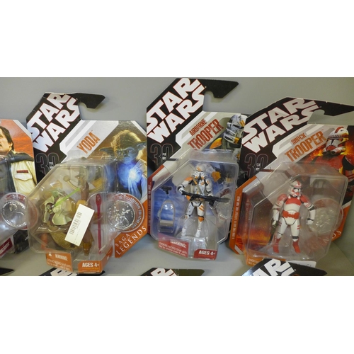 769 - Ten Hasbro Star Wars figures with Exclusive Collector coins, packaged