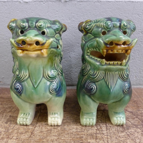 796 - A pair of green Chinese dogs of foe, 19cm