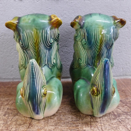 796 - A pair of green Chinese dogs of foe, 19cm