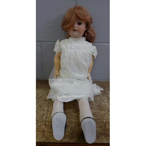802 - A rare antique German Julius Hering Victoria bisque head doll, composition wood jointed body, 25