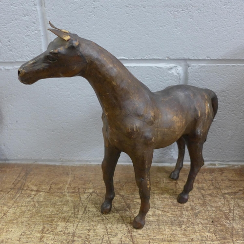 805 - A Liberty & Co. style leather model of a horse, 30cm