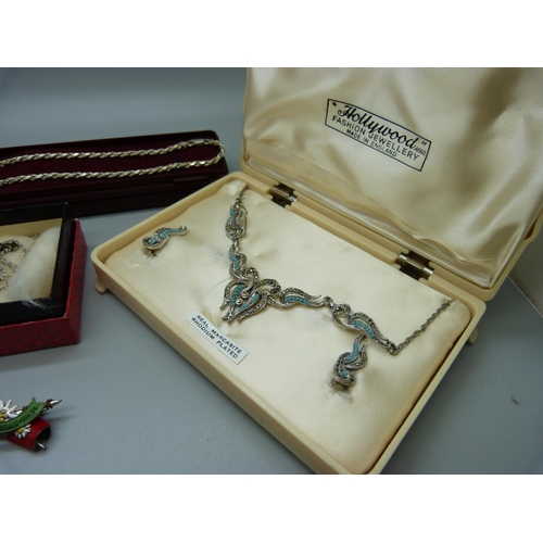 833 - Costume and silver jewellery including a necklace and earrings set in a box marked Hollywood