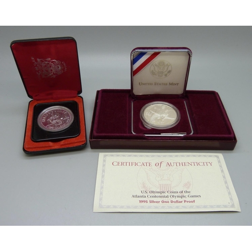 839 - Two silver one dollar coins; United States 1995 Olympic commemorative, cased, and Canada 1975 Calgar... 