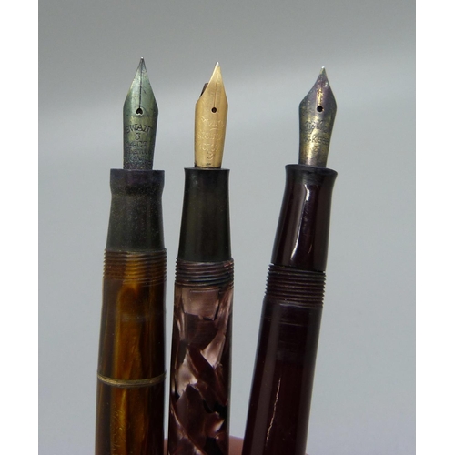 854 - Three ink pens with 14ct gold nibs, Swan Leverless, Conway Stewart 85 and one with associated top ma... 