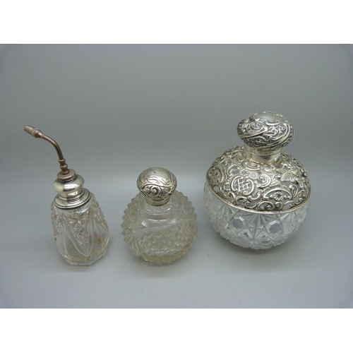 867 - Three silver mounted glass scent bottles, the largest hallmarked Birmingham 1898