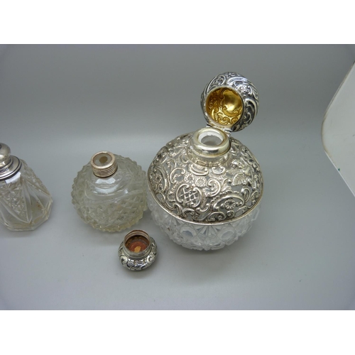 867 - Three silver mounted glass scent bottles, the largest hallmarked Birmingham 1898