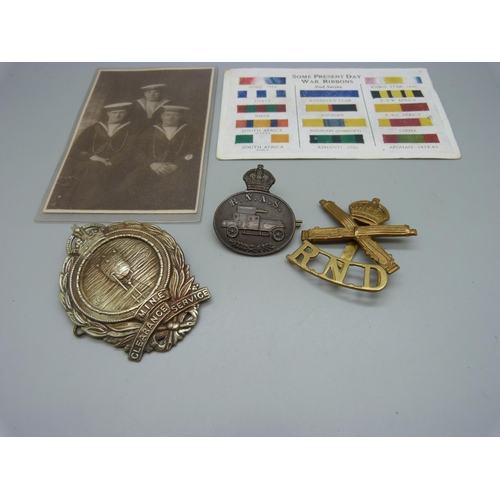 891 - Three British military badges and two postcards, (Mine badge a/f)