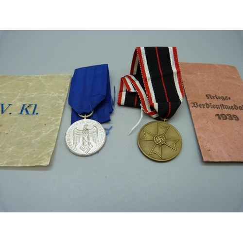 894 - Two WWII German medals with envelopes