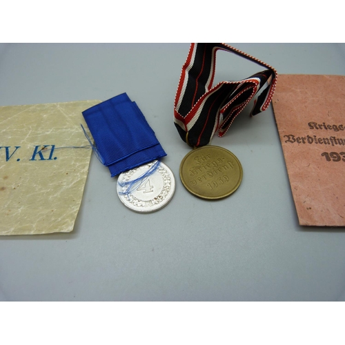 894 - Two WWII German medals with envelopes