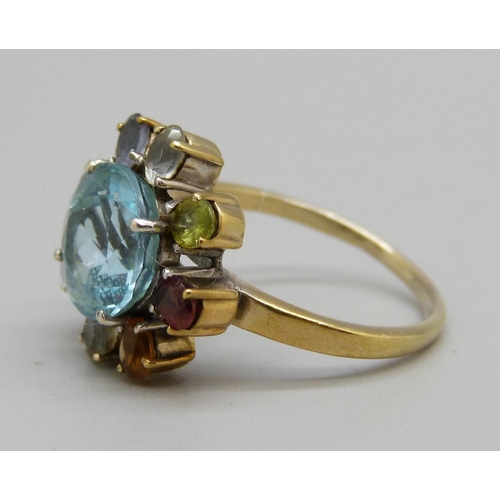 922 - A silver gilt, blue topaz and multi-gem cluster ring, S