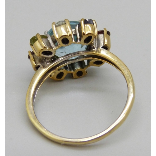 922 - A silver gilt, blue topaz and multi-gem cluster ring, S