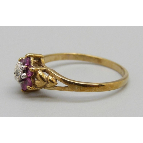 924 - A 9ct gold ruby and diamond cluster ring, 1.6g, O