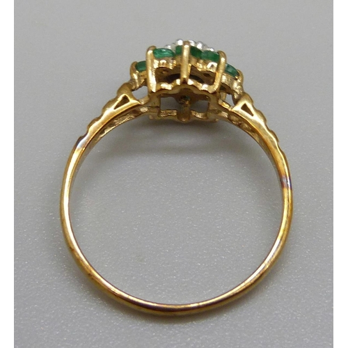 929 - A 9ct gold, emerald and diamond cluster ring, 1.6g, M