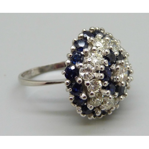 939 - A large 18ct white gold, sapphire and diamond cluster ring, 22x 0.10ct sapphires, plus 13 diamonds, ... 