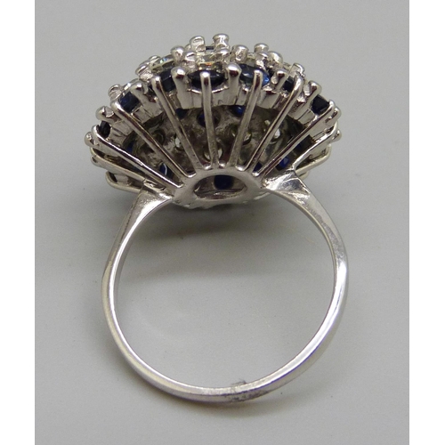 939 - A large 18ct white gold, sapphire and diamond cluster ring, 22x 0.10ct sapphires, plus 13 diamonds, ... 