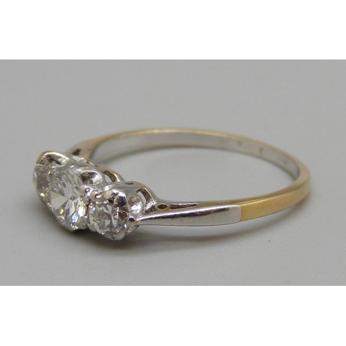 968 - An 18ct gold, platinum and three stone diamond ring, brilliant cut diamonds, approximately 0.65ct to... 