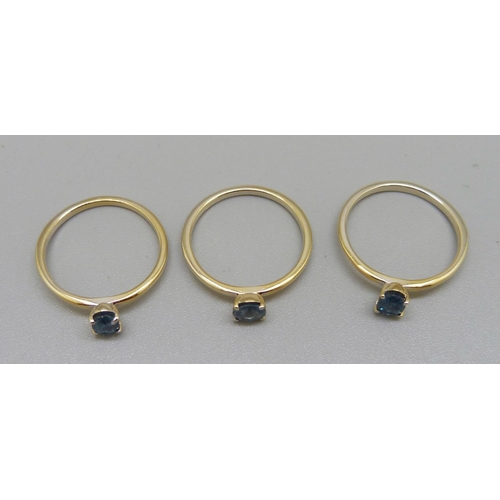 986 - Three silver gilt rings set with kyanite, two with oval stones, one with round stone, with certifica... 