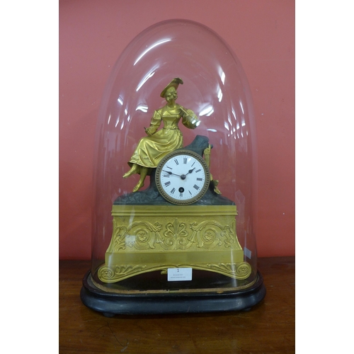 1 - A 19th Century French glass domed gilt metal mantel clock, on ebonised stand